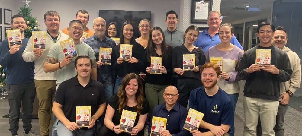 Clarity team at the annual holiday packing party with Holiday Heroes