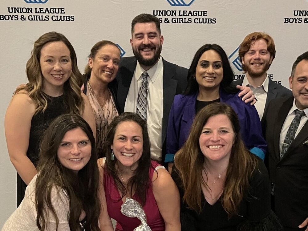 The Clarity team poses for a photo at the Union League Boys and Girls Clubs Annual Wine Dinner